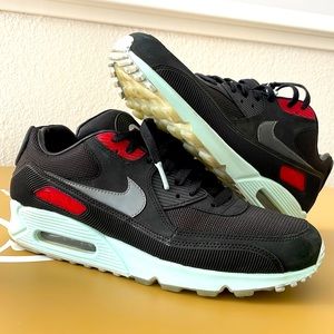 Nike Air Max black with red and baby blue accents.